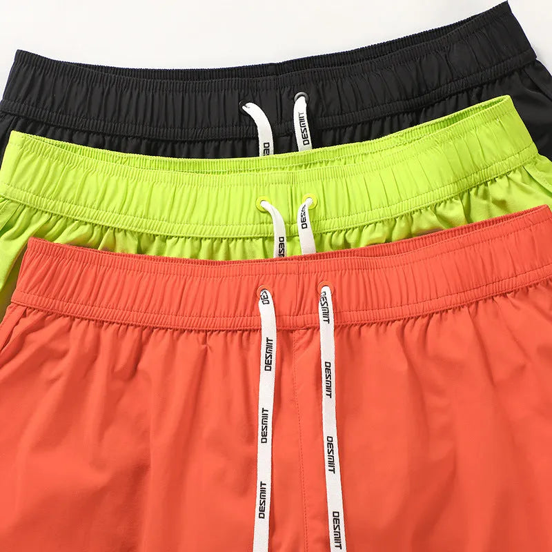 Men's loose beach surfing trousers with elastic waistband in orange red colour