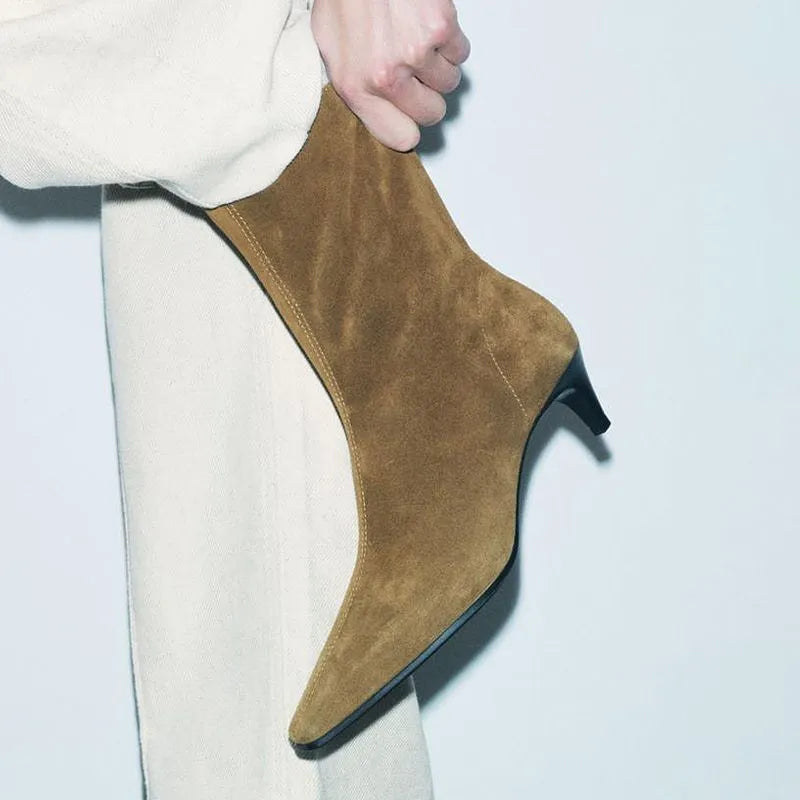 Brown women's square toe ankle boots with a side zip and a stiletto kitten heel on a waterproof platform sole.