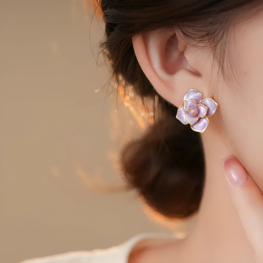 Purple flower stud earrings with gold plating and oil-spot glaze finish on copper construction