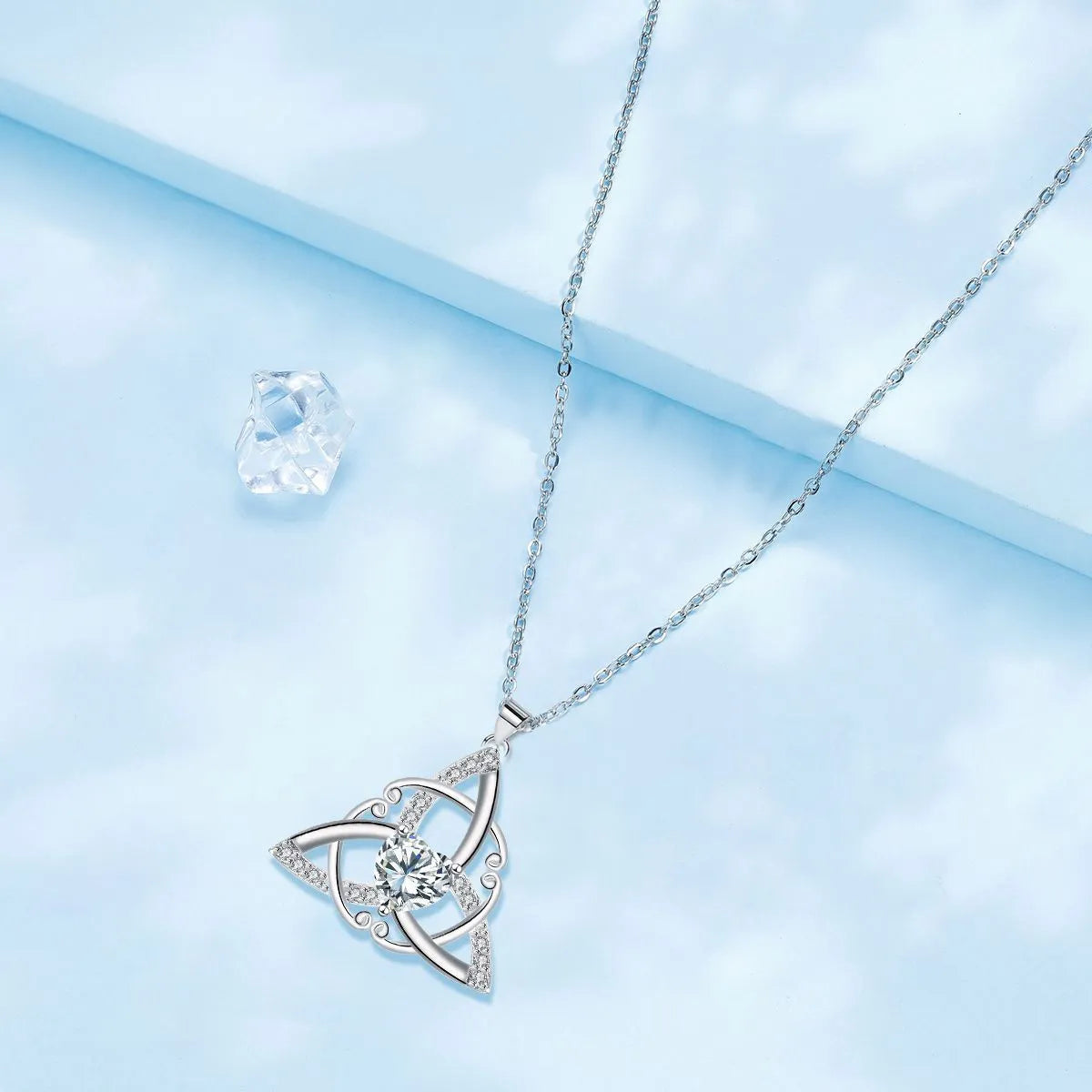Geometric Celtic knot copper necklace for women showing blue electroplated colour option.