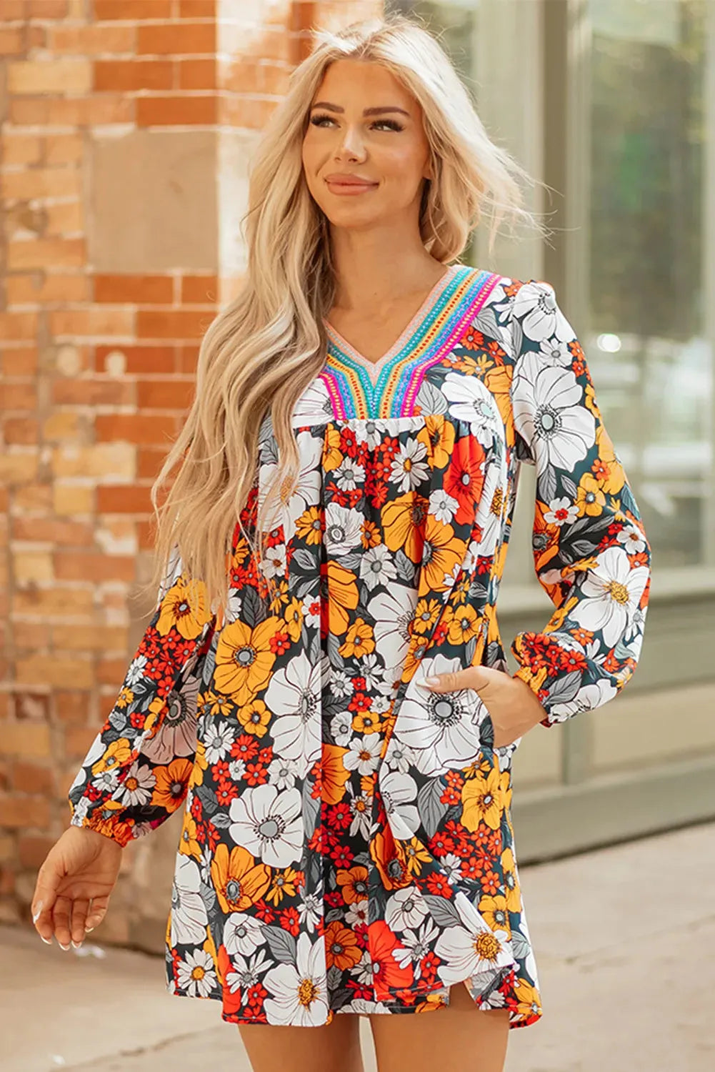 Orange floral print striped lace V-neck long sleeve mini dress on hanger