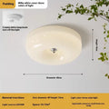 Cream coloured American style bedroom ceiling lamp with a modern vintage design shown in a bedroom setting.