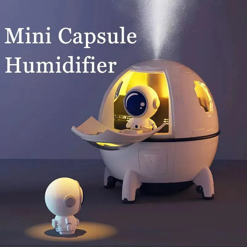 Astronaut-themed desktop humidifier with colourful LED lights showing 110mm cubic dimensions