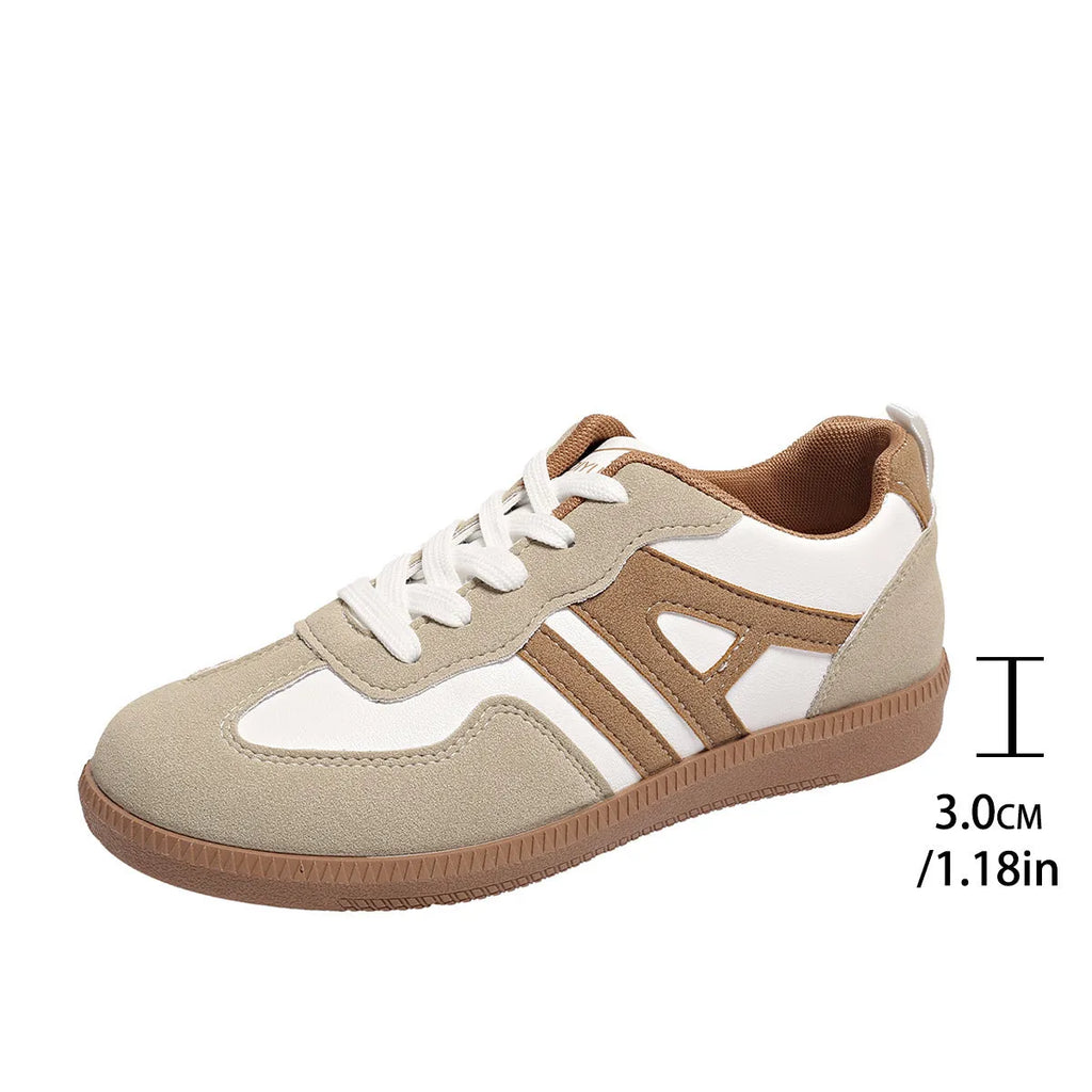 Women's retro colour-block lace-up jogging shoes in grey with a low platform heel and rubber sole.