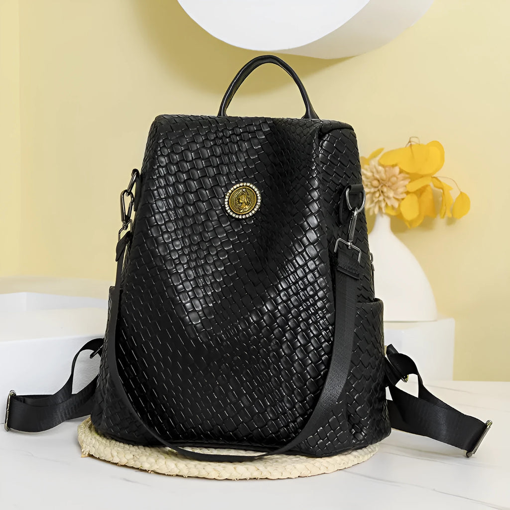 Women's black anti-theft backpack with woven details and multiple compartments