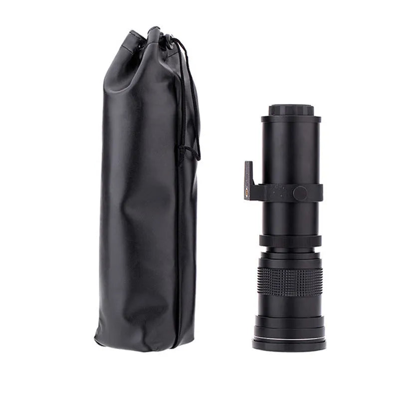 420-800mm manual telephoto zoom camera lens with T-mount adapter on a grey background.