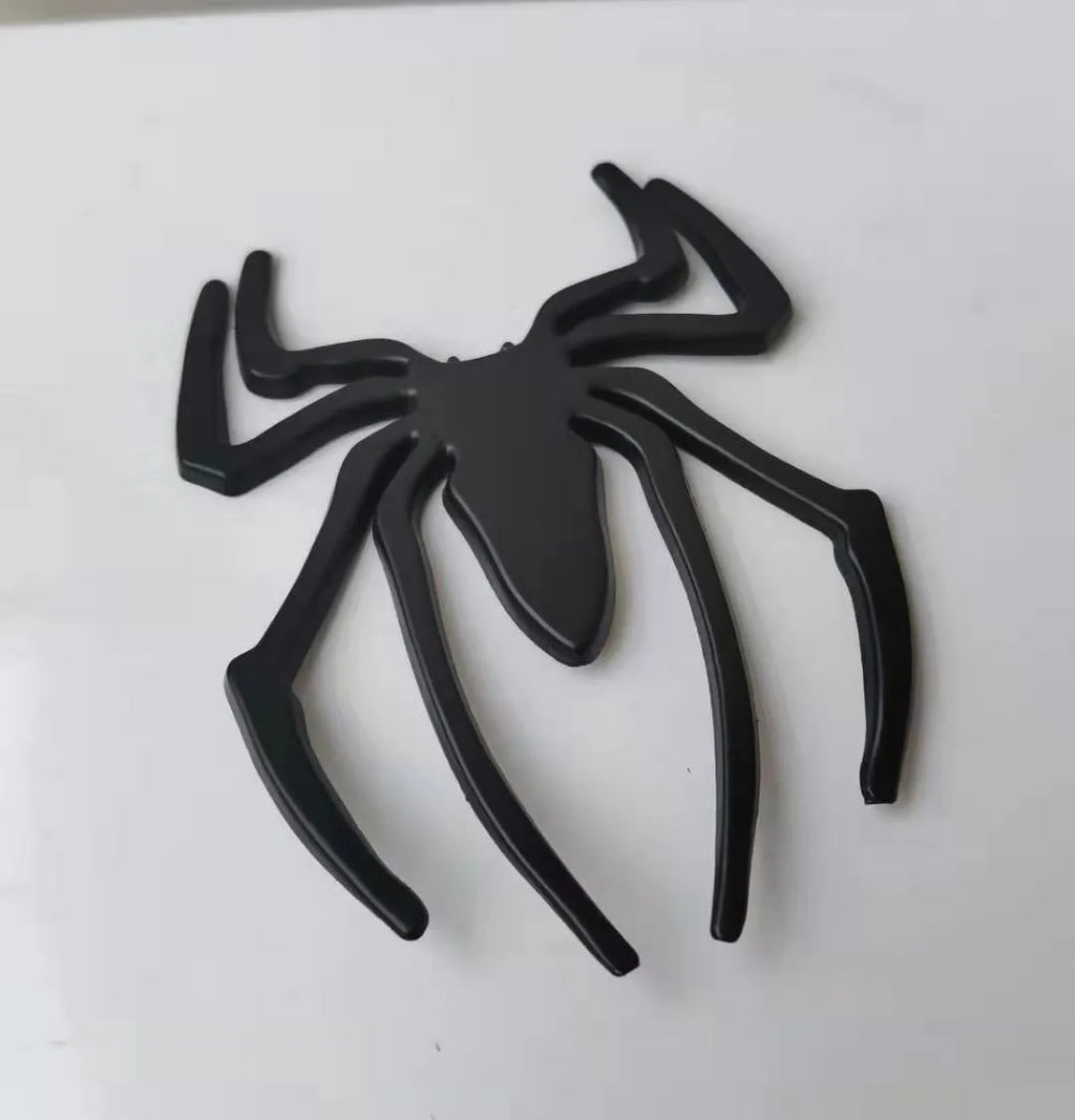 3D metallic spider bumper sticker in zinc alloy, shown in gold colour.