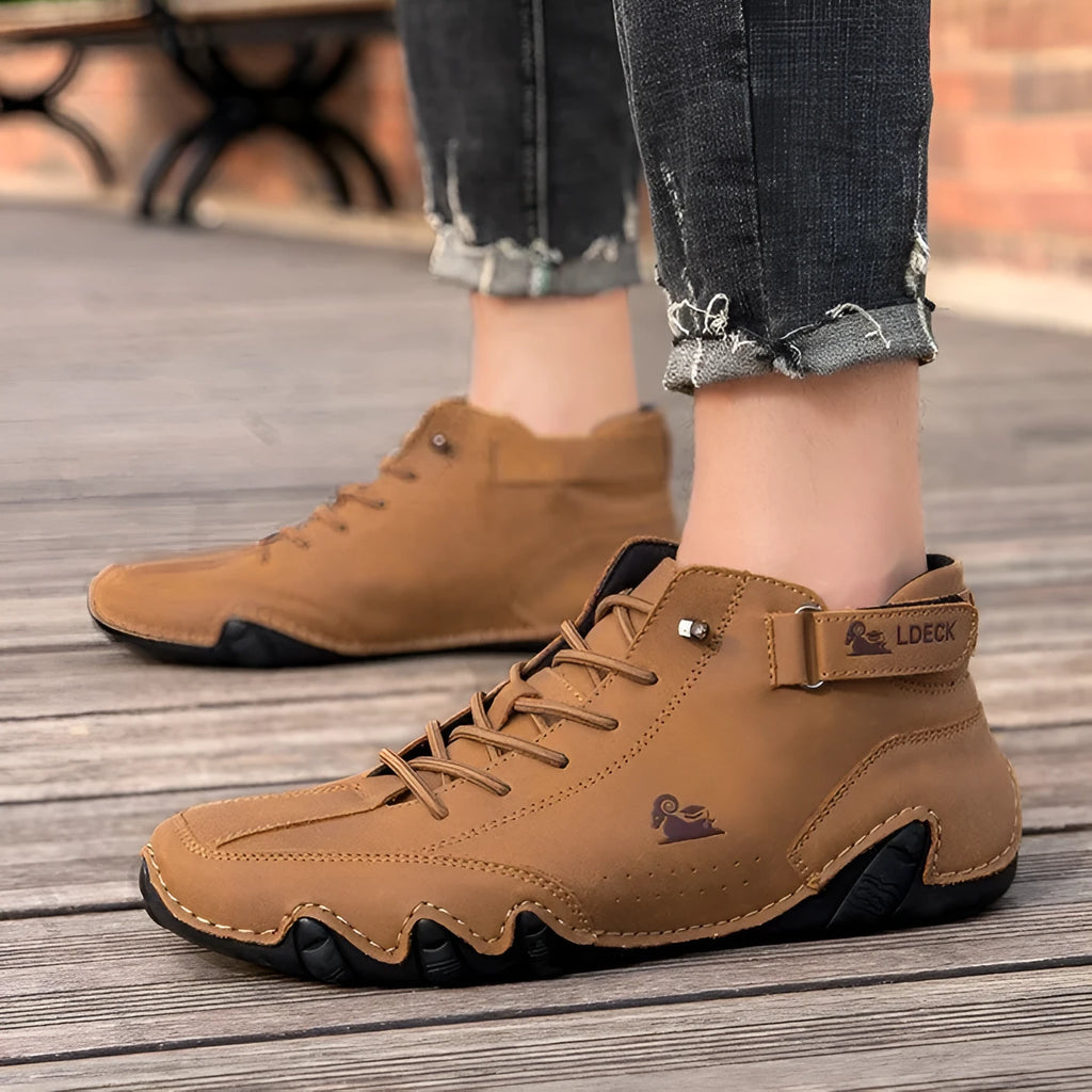 Men's khaki high top octopus shoes with round toe and rubber sole.