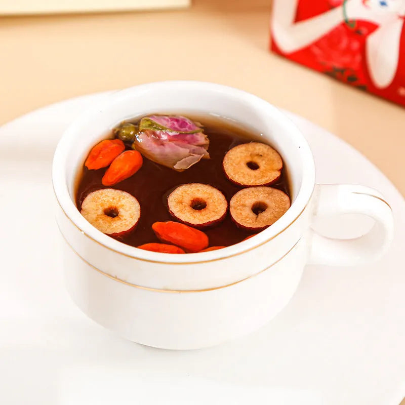 A 150g box of brown sugar ginger tea bags containing red dates, wolfberry, longan and rose