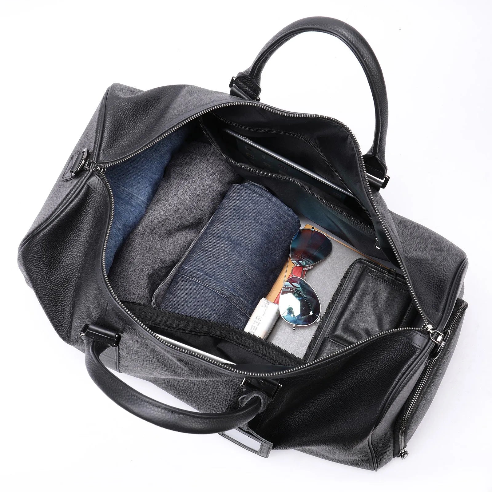 Men's black leather excursion tote bag with single shoulder strap showing substantial capacity