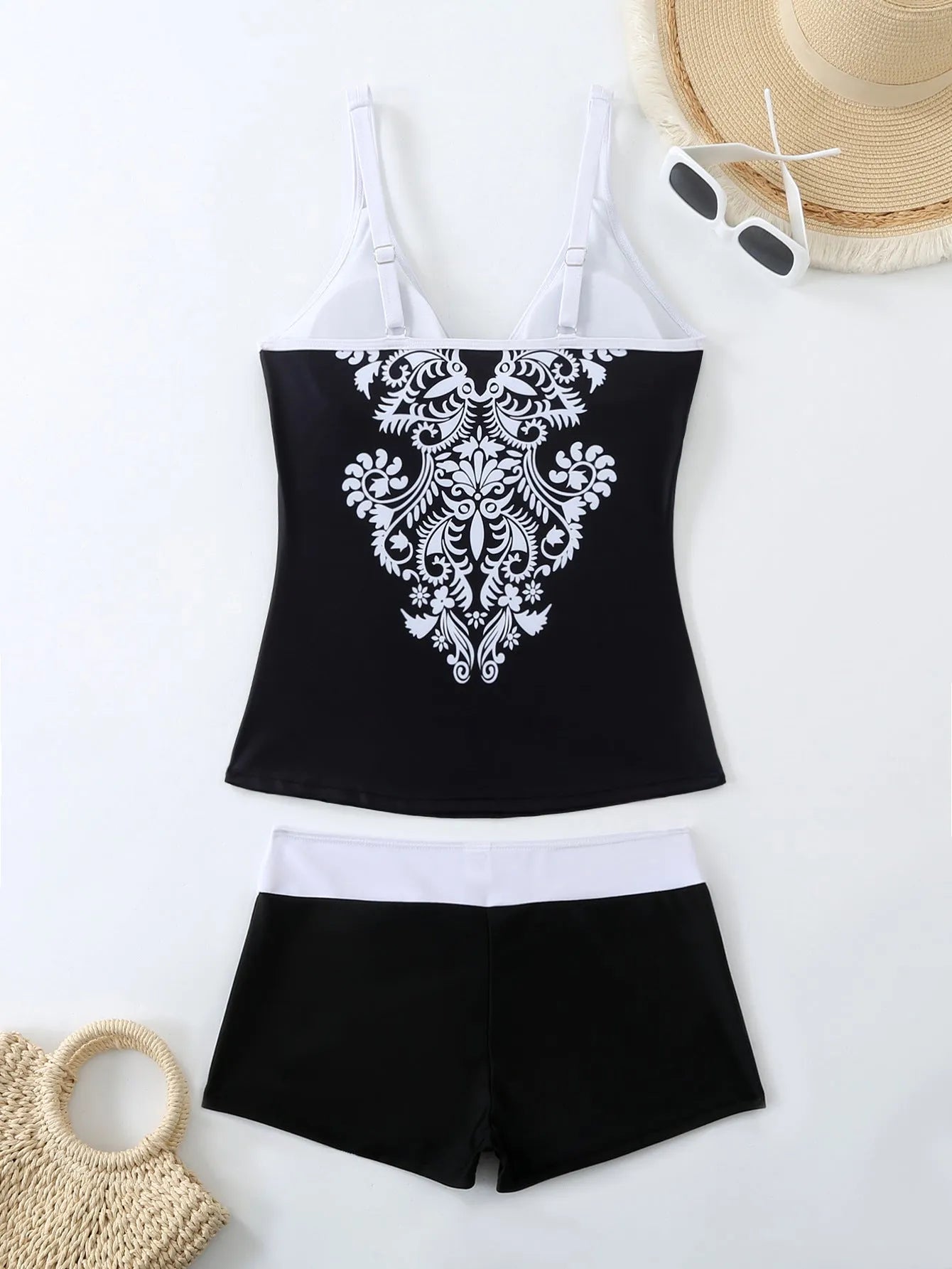 Plus size women's two-piece swimsuit in black or rose red with printed design