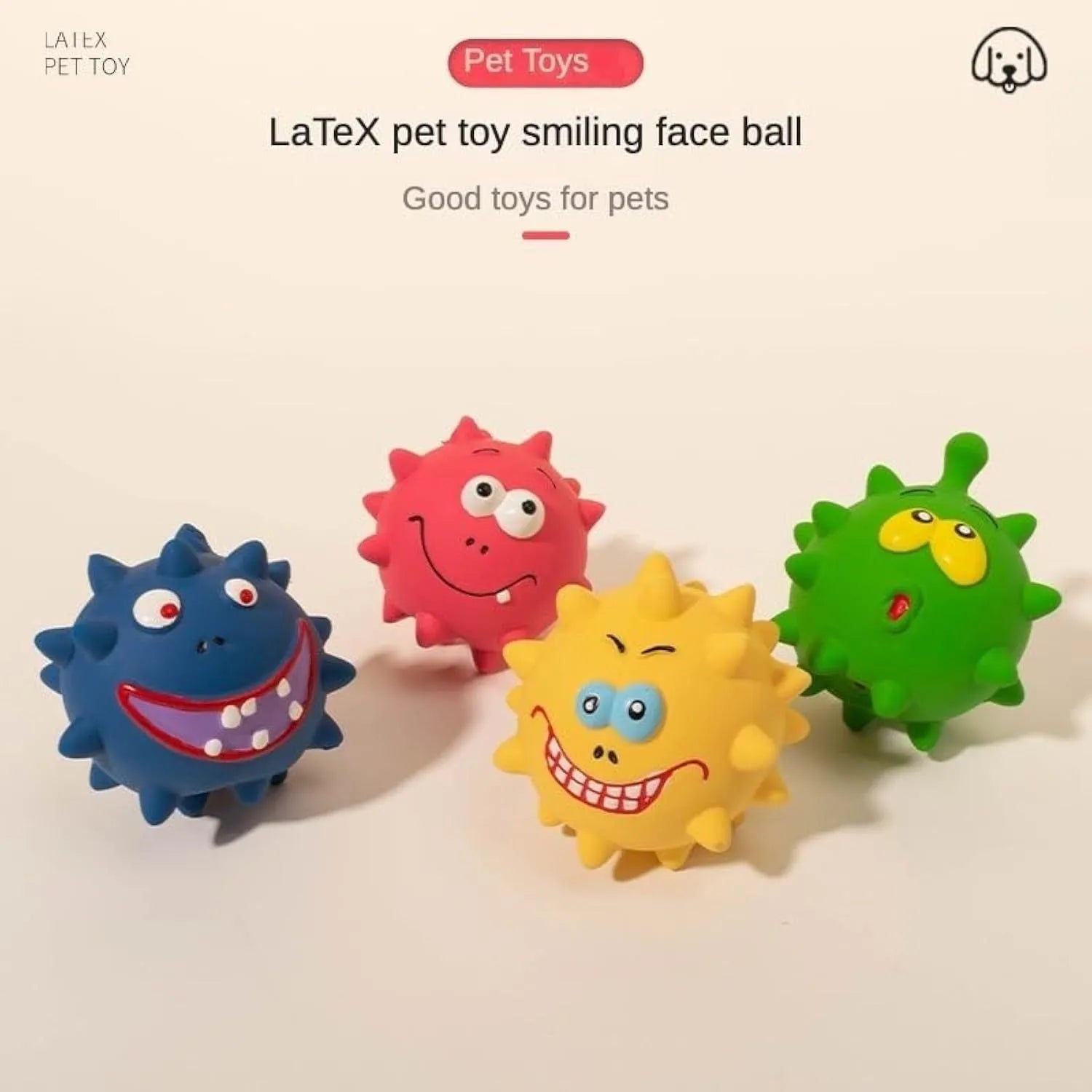 Four colourful natural latex squeaky dog toy balls with cute faces on a blue background.