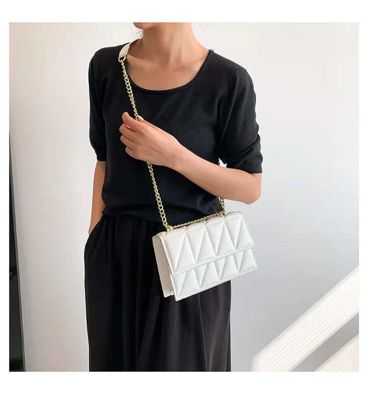 Small square PU chain crossbody bag in horizontal shape with spliced detail, available in five colours.