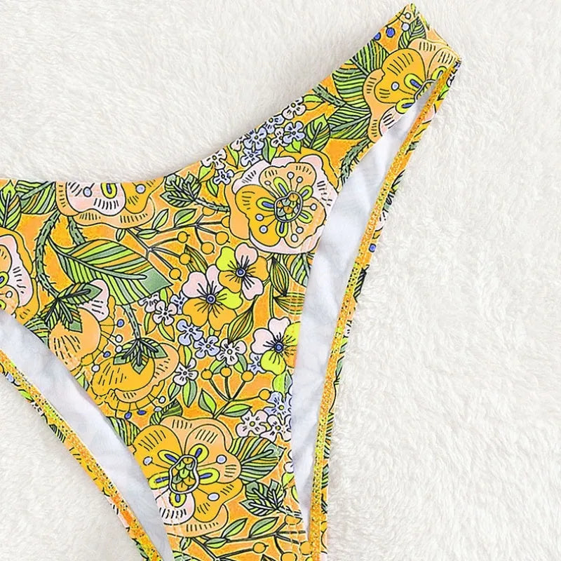 New printed polyester sling bikini set in peacock blue with brief bottoms, front view