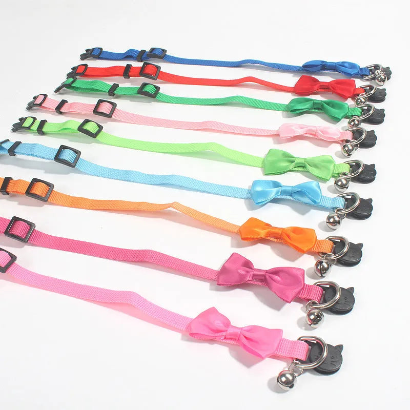 Adjustable nylon cat bow collar with a bell in a striped pattern, shown in a bright colour.