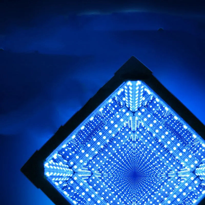 Thousand Mirrors 3D magic cube RGB LED lamp in black finish with remote control on desk