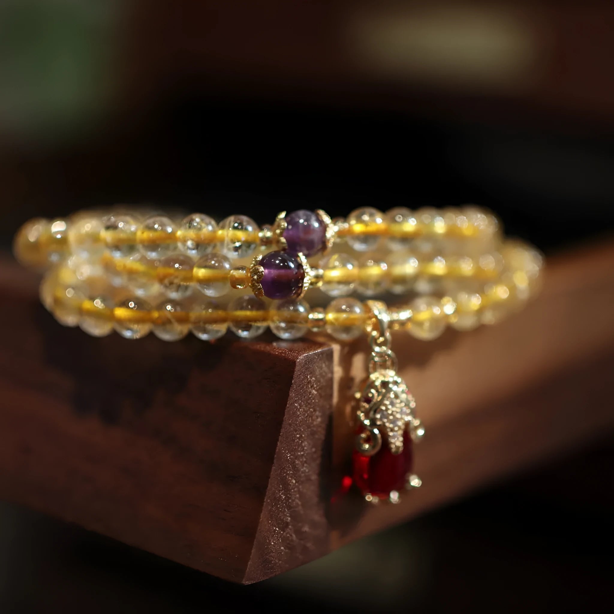 Natural Brazil gold rutilated quartz bracelet with three gold circles and ruby quartz charms in Chinese style