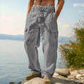 Man wearing loose light army green cotton wide-leg casual trousers with a micro-elastic mid-waist.
