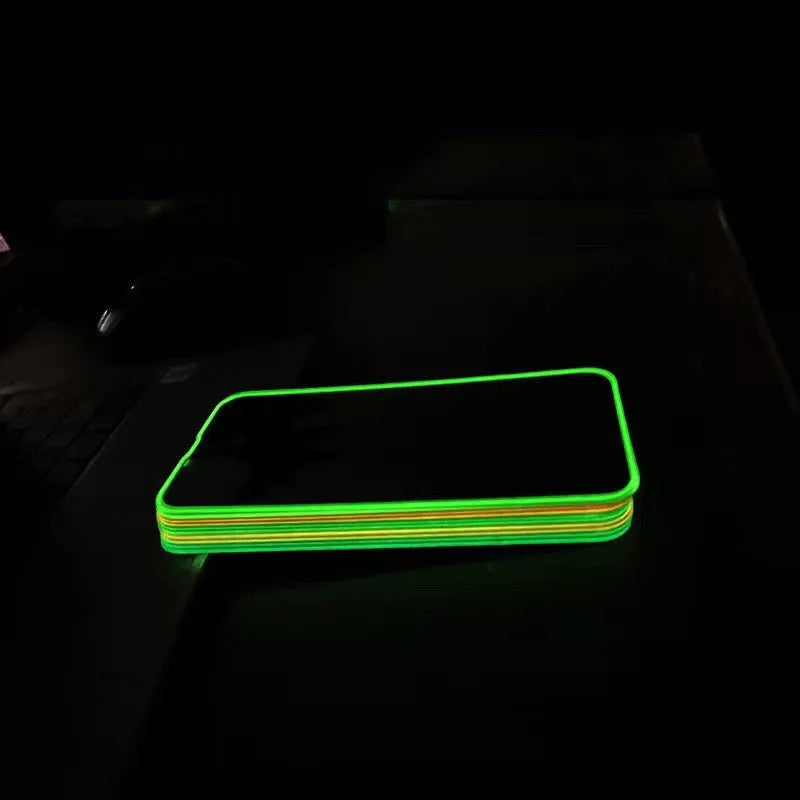 Fluorescent glowing tempered glass screen protector for iPhone on a dark background.
