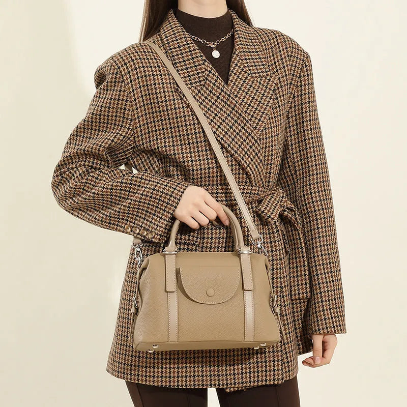 Genuine leather ladies handbag with contrast stitching and lock detail in street-trend style