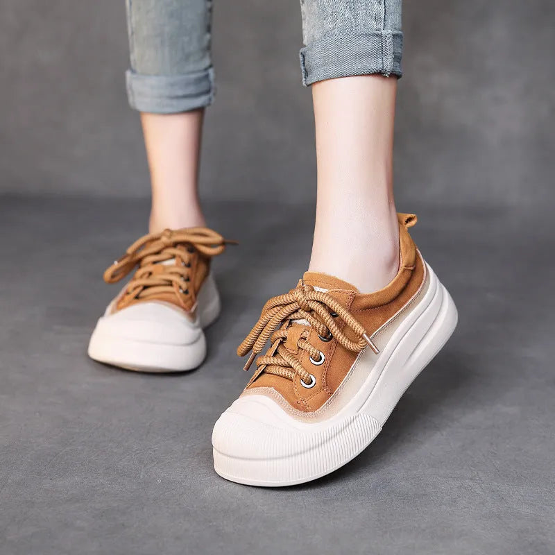 Yellow women's leather lace-up casual shoes with round toe on a plain background.