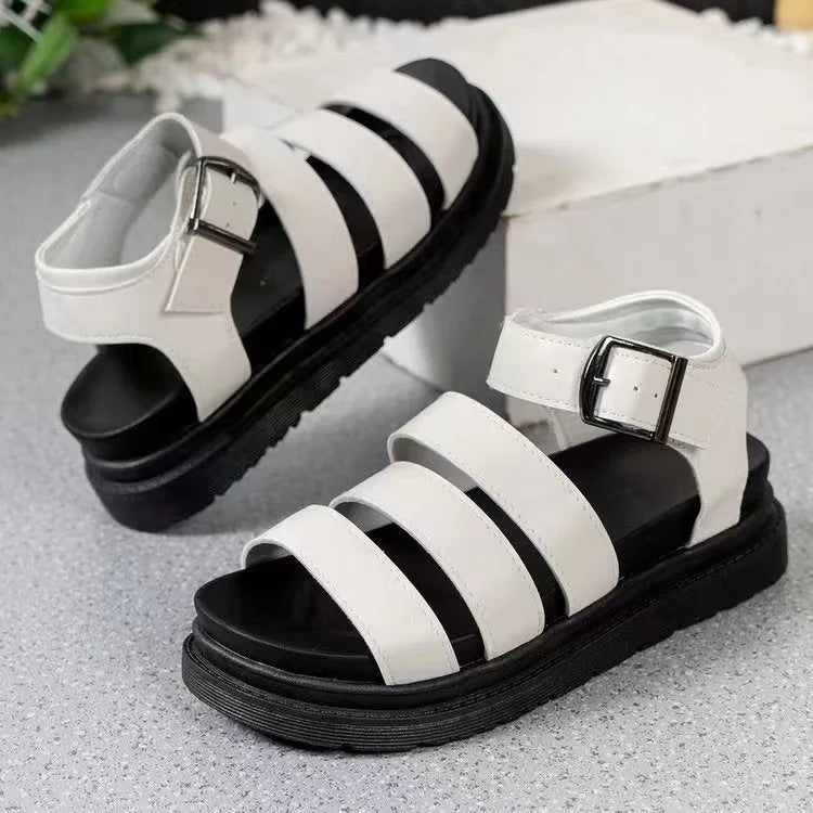 Black outdoor sandals with thick rubber soles and adjustable buckle straps showing fish mouth round toe design