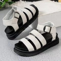 Black outdoor sandals with thick rubber soles and adjustable buckle straps showing fish mouth round toe design