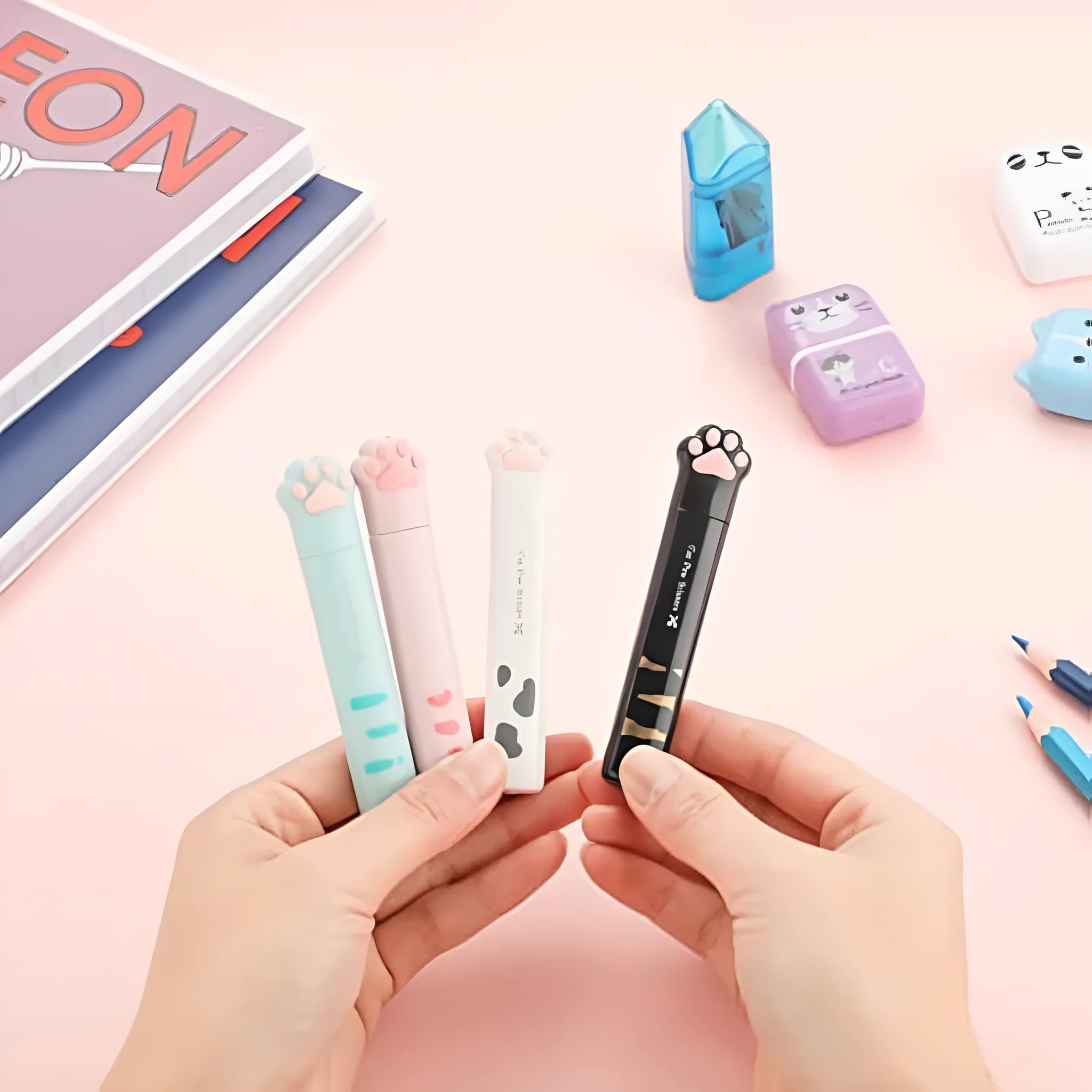 Cat paw mini folding scissors showing stainless steel blades and decorative claw design in four colour options