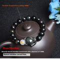 Natural obsidian zodiac guardian bracelet with 10mm beads on an adjustable cord.