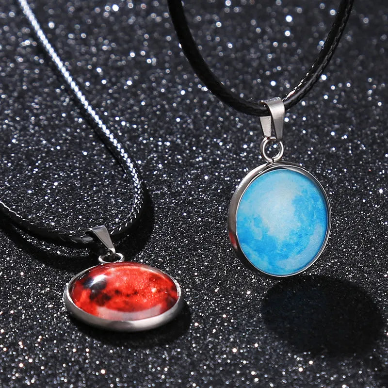 Luminous alloy necklace with a glass pendant depicting a Christmas moon night sky, showing the extension chain.