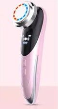 Beauty instrument cleanser in rose pink with three speed settings on white background