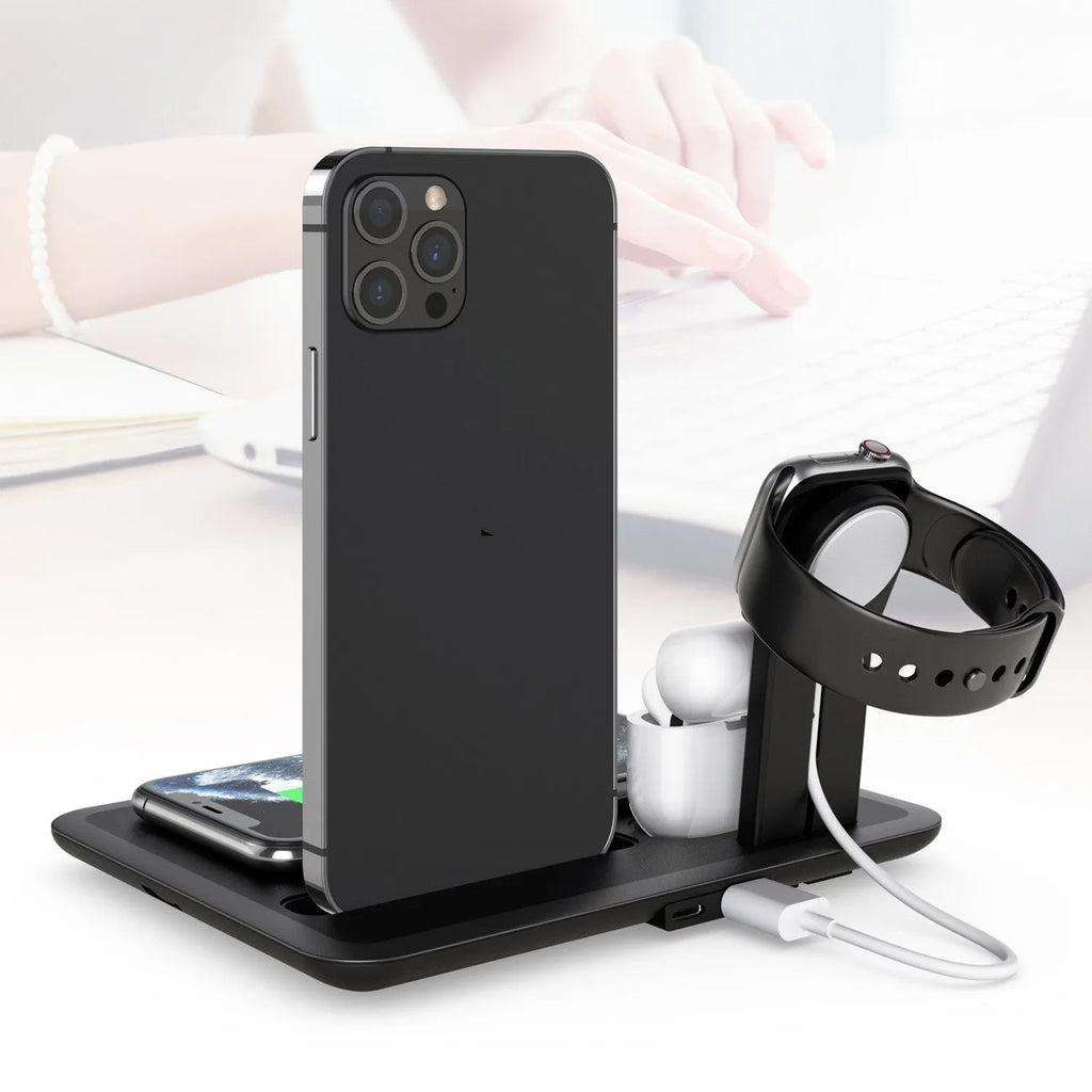 Black wireless desktop charging station with phone charging pad, watch USB port, and headphone charging port