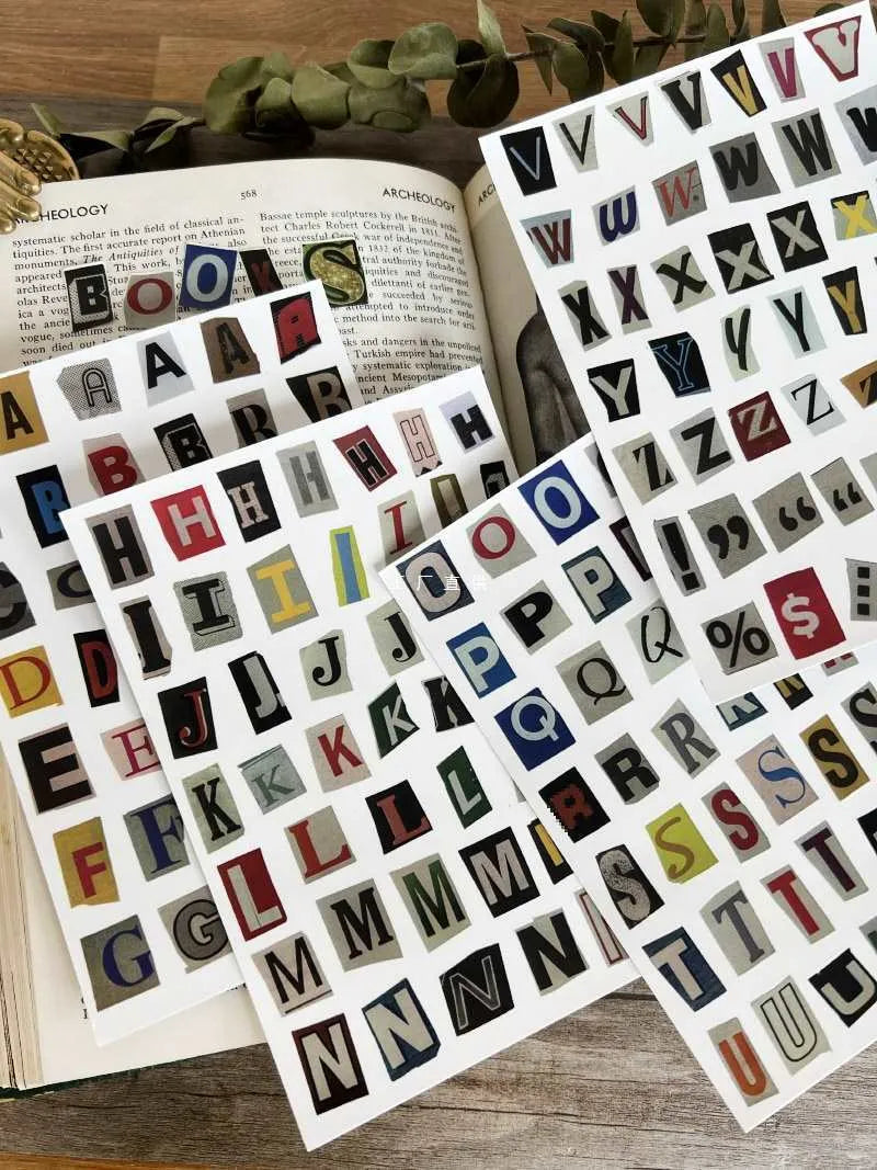 A set of cute-style decoration stickers showing printed English letters and weekly words like Monday, Tuesday.