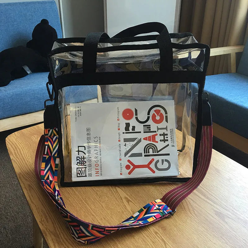 Women's transparent PVC front crossbody messenger bag with black side net pocket and double shoulder straps.