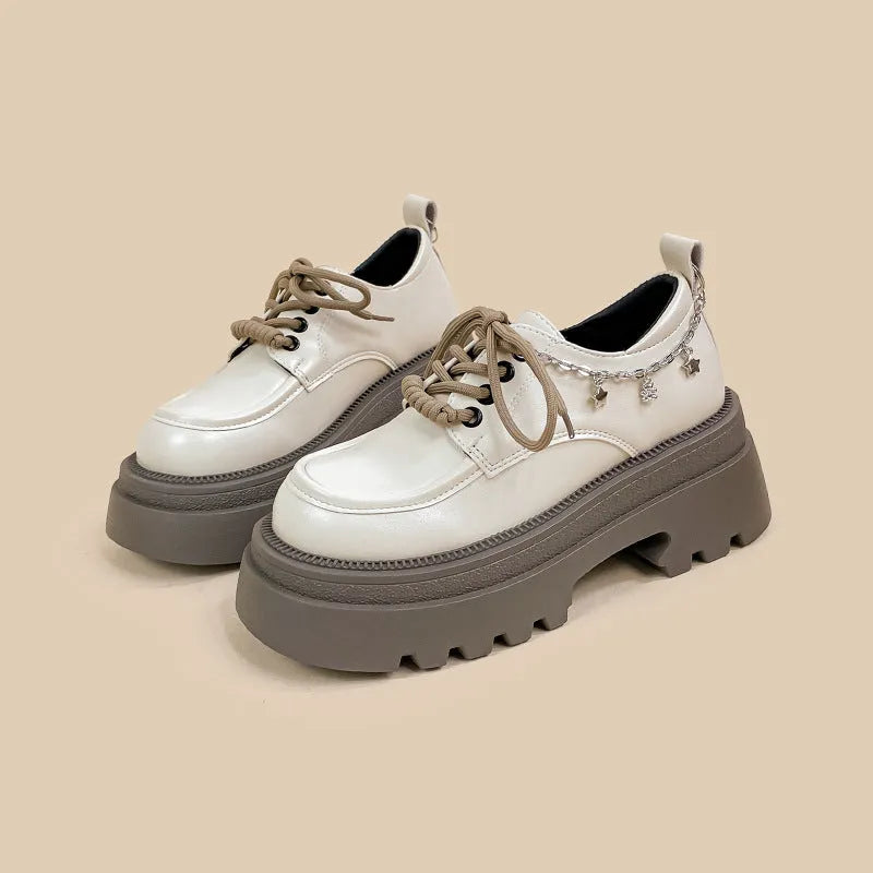 White women's platform Mary Jane shoes with round toe, chunky heel, and front lace-up in British college style.