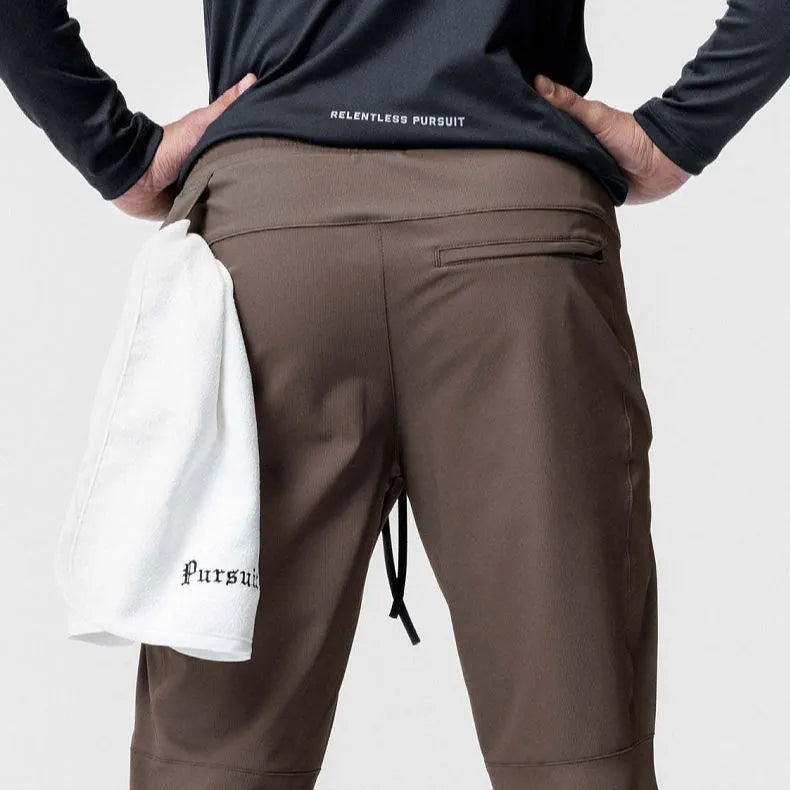 Men's grey quick-dry fitness pants with ankle ties in loose casual style