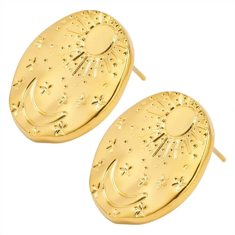 A pair of geometric shell-shaped stud earrings in stainless steel with a gold or silver electroplated finish.