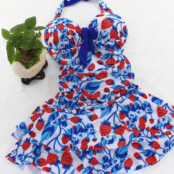 Women's one-piece swimsuit with cross strap backless design and strawberry print in blue strawberry colour