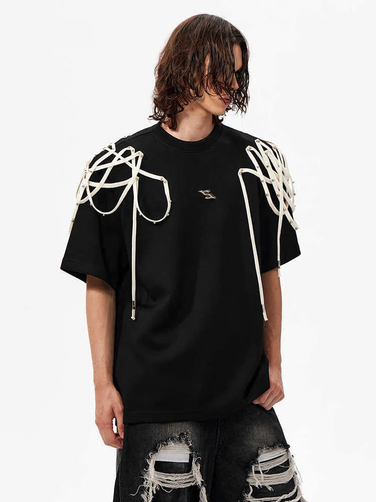 Black loose fit T-shirt with padded shoulders and short sleeves on hanger