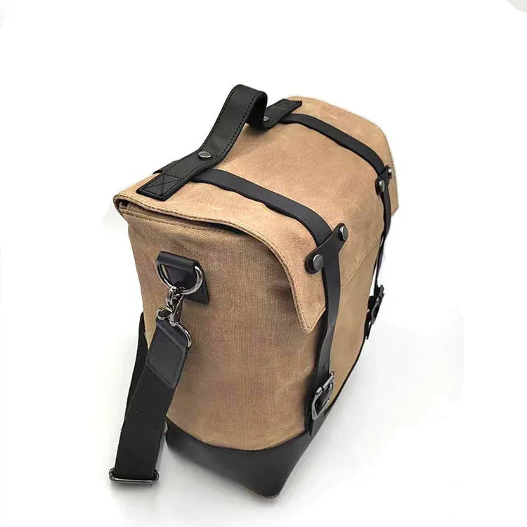 Waterproof canvas motorcycle side bag with cowhide detailing in black colour