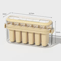Portable popsicle mold in beige colour, made from PP and PET, measuring 23.4 cm long