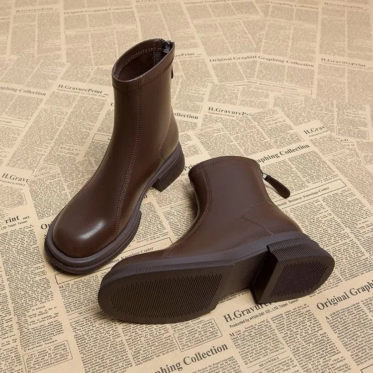 Women's flat heel ankle boots with round toe and back zip closure in black or brown colours