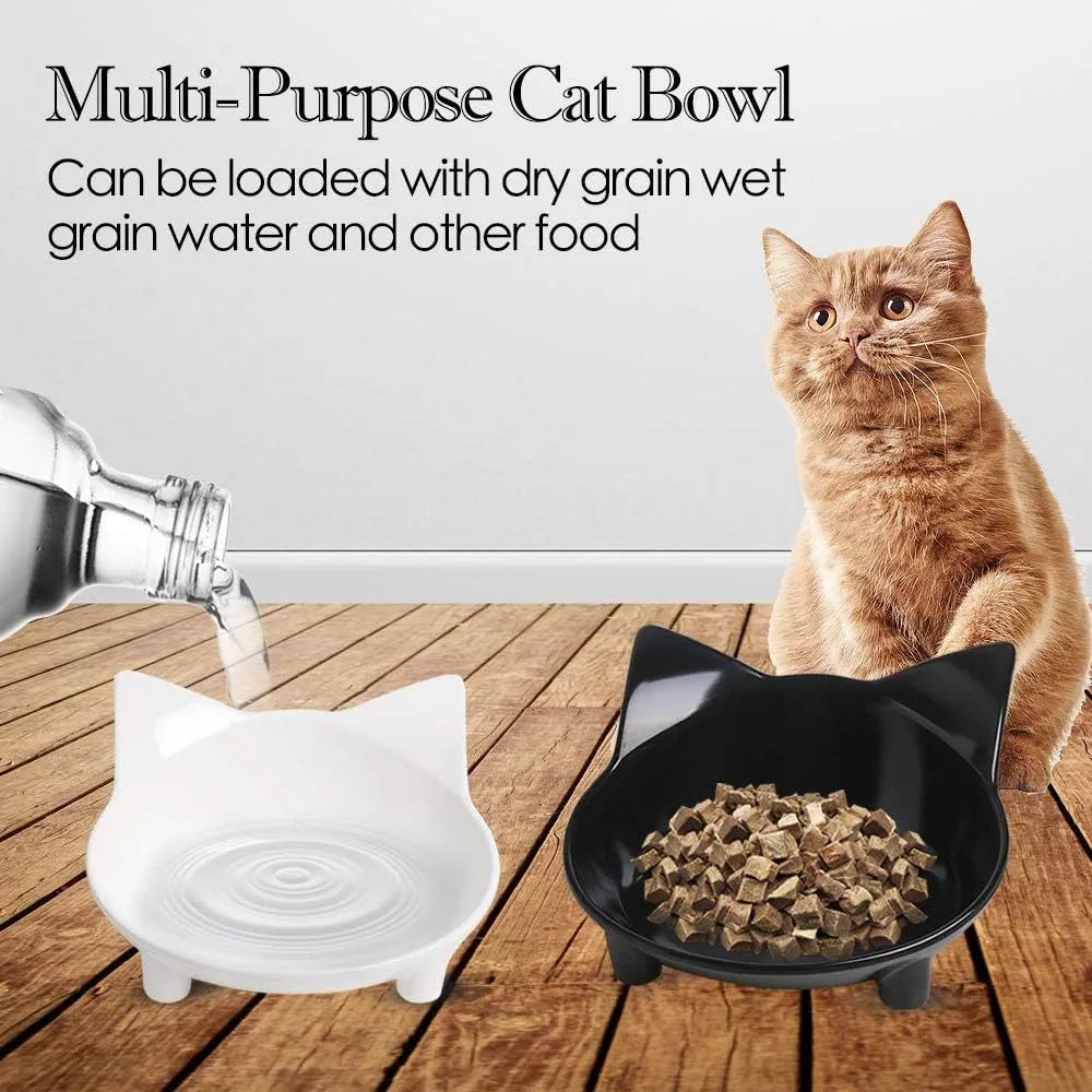 Shallow black melamine cat bowl with non-slip rubber base on a kitchen floor