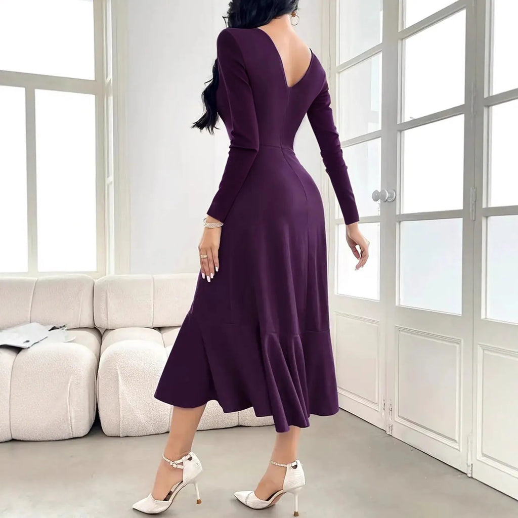 Purple women's long sleeve dress with round neck and ruffle detail on a mid waist.