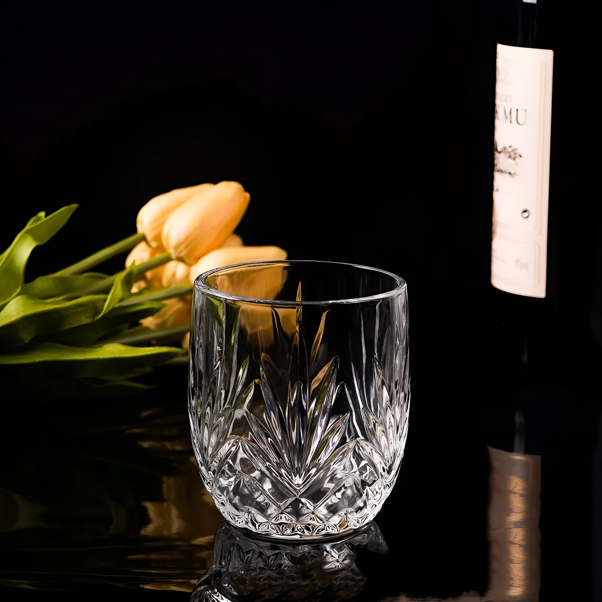 Clear thick-bottomed whiskey shot glass on a table showing 40ml capacity and solid base.