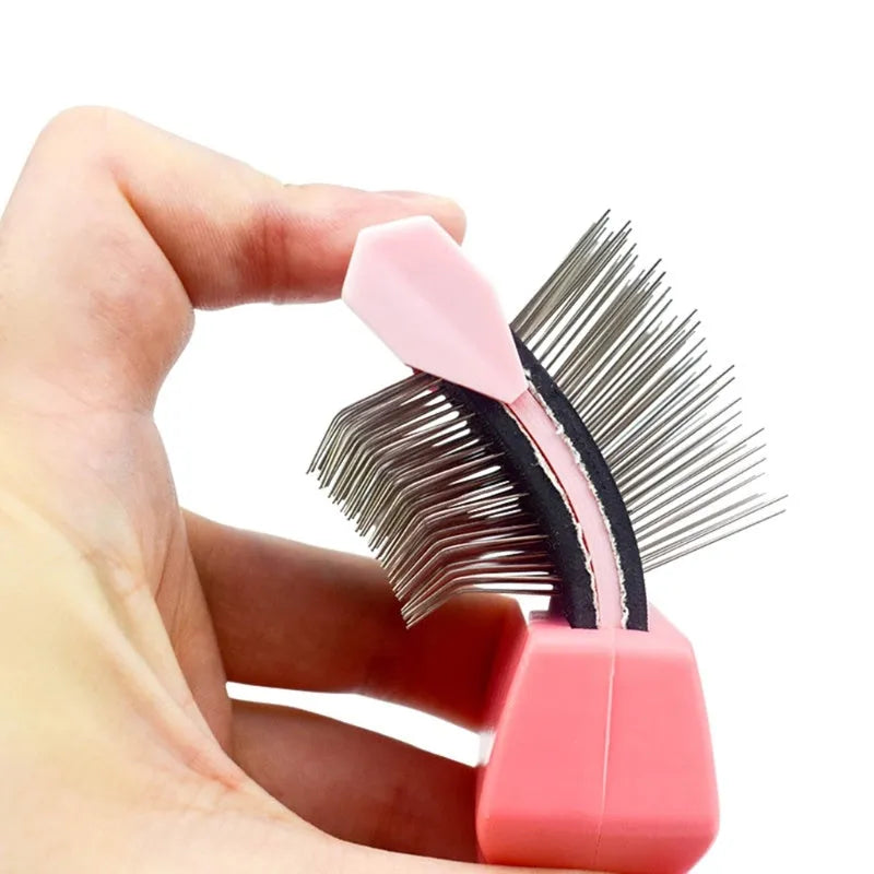 Blue double-sided pet brush with stainless steel pins on a white background, showing both gentle and firm bristle sides.