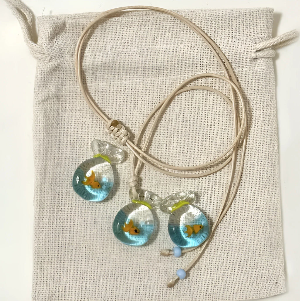 Women's skirt and joker charm pendant necklace with coloured glass on a cotton linen clavicle chain.