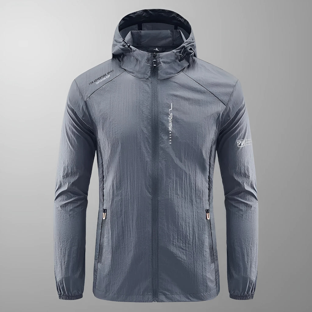 Man wearing a lightweight grey hooded nylon summer jacket for sun protection.