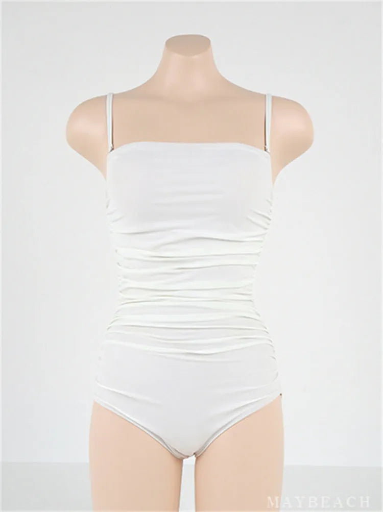 Blue women's one-piece swimsuit with sling neck and pleated front on a mannequin