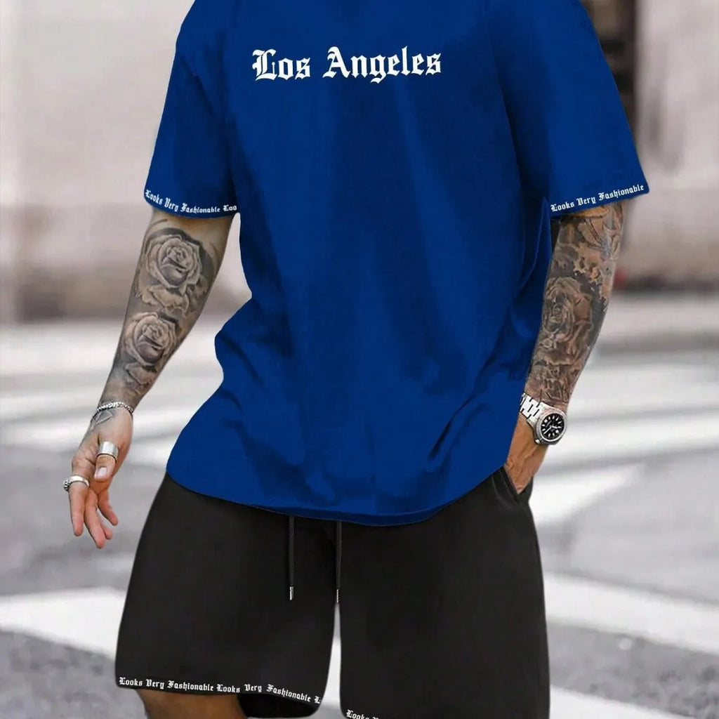 Men's blue printed short-sleeve top and matching shorts sports suit on a hanger.
